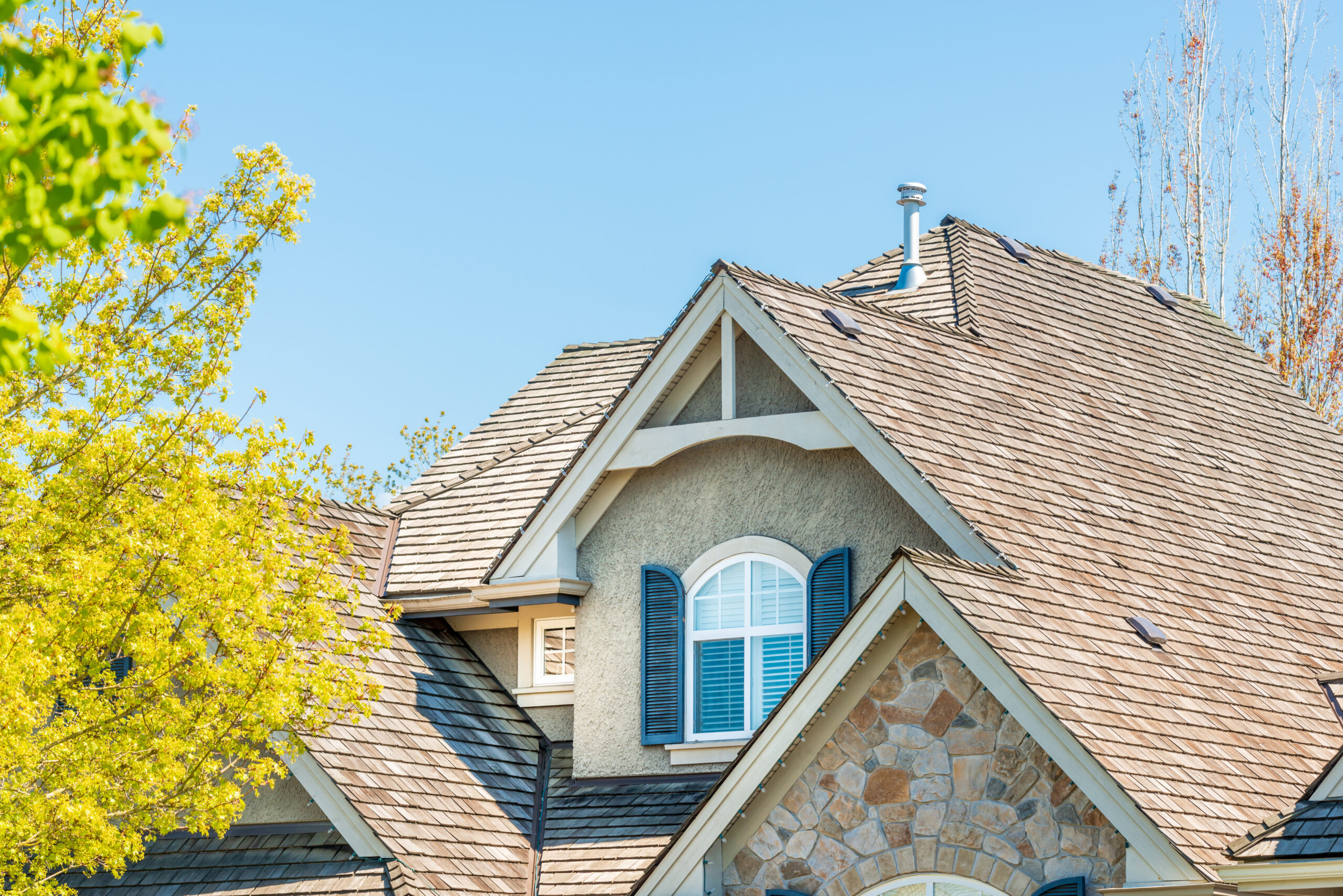 Professional roof replacement with wood shake shingles on a residential home in Nashville TN.